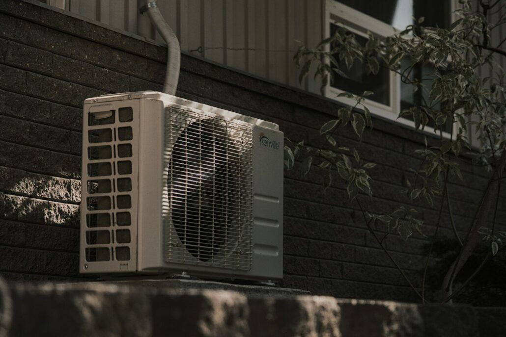 jspkvrhmqoo 1030x687 | Essential Website Tips for HVAC Companies to Thrive Online | iGlobalWeb a white air conditioner sitting on top of a brick wall