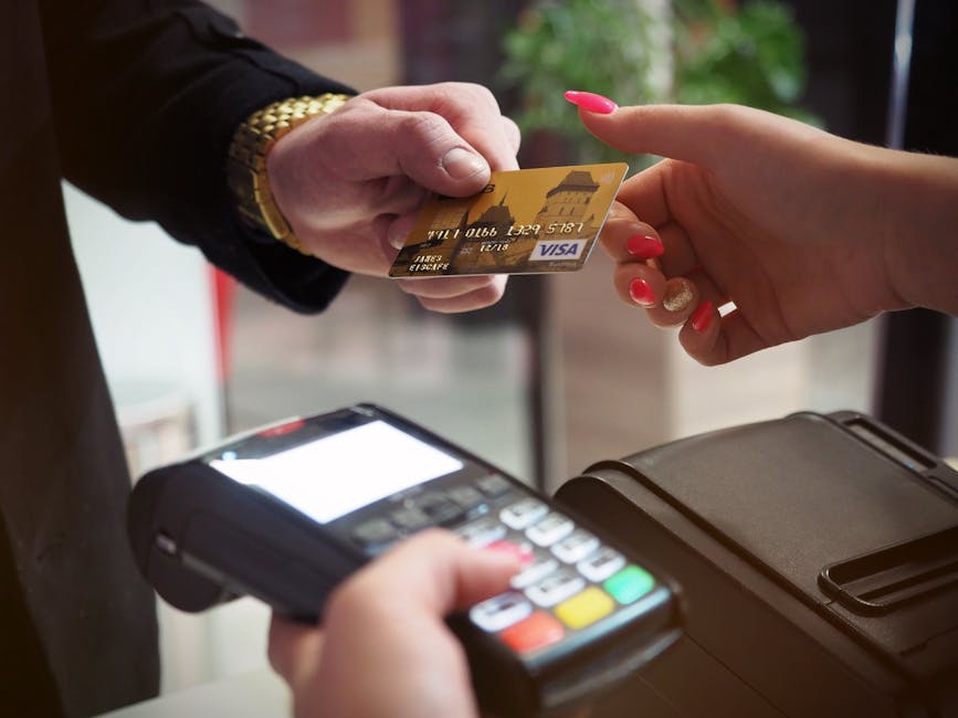 e-commerce website Close-up of a credit card payment being processed at a POS terminal.